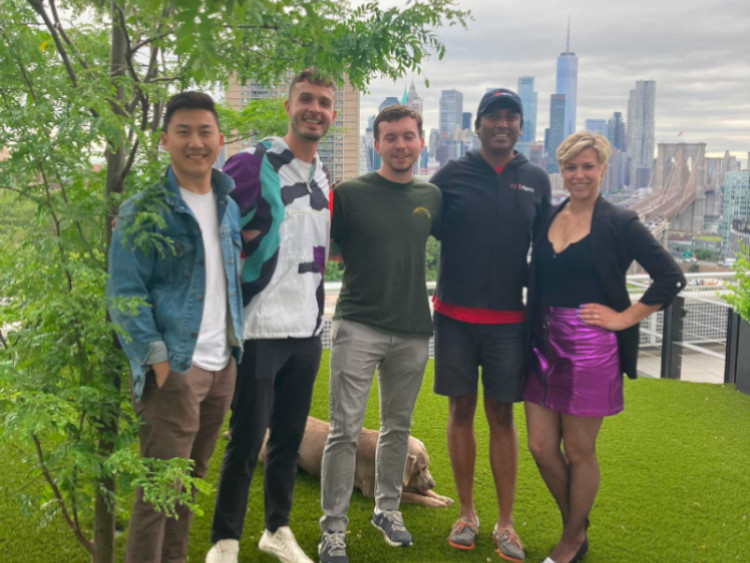 A picture of Amanda and our attendees with the NYC skyline behind them