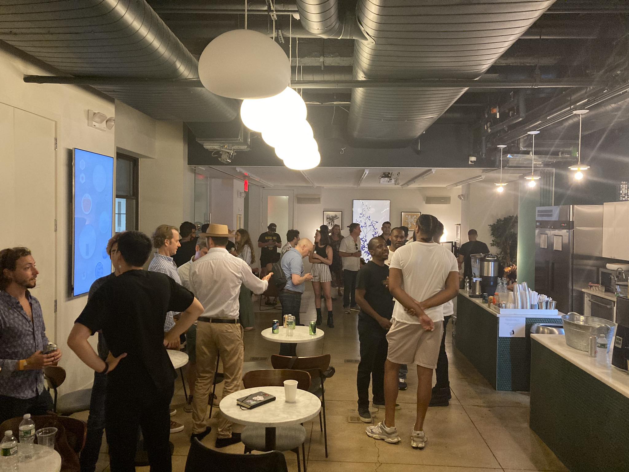 A picture of attendees mingling at Station3 for the Web3Builders event